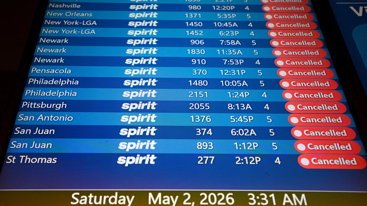 A departure board displays cancelled Spirit Airlines flights at Orlando International Airport, as the airline announced it was ceasing operations early Saturday morning following an impasse in talks with some creditors on a $500 million government bailout plan, in Orlando, Florida, U.S., May 2, 2026. REUTERS/Miguel Rodriguez