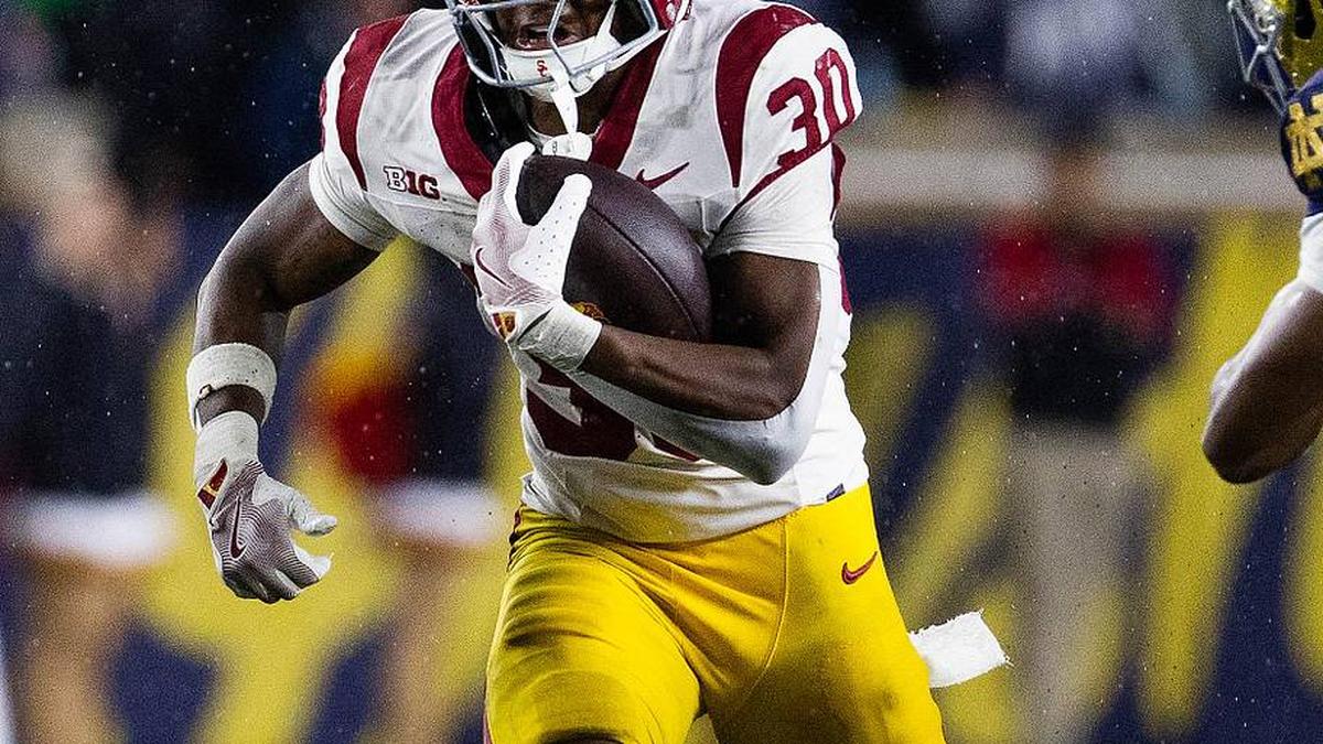  Oct 18, 2025; South Bend, Indiana, USA; Southern California Trojans running back King Miller (30) runs the ball while Notre Dame Fighting Irish safety Tae Johnson (9) defends in the second half at Notre Dame Stadium. Mandatory Credit: Trevor Ruszkowski-Imagn Images | Trevor Ruszkowski-Imagn Images 