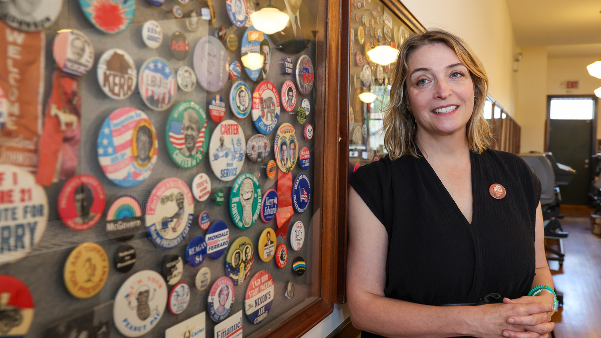 Christen Carter, founder of the Button Museum and owner of the Busy Beaver Button Co., with some of the buttons in the museum on June 15, 2026, in Chicago. (Stacey Wescott/Chicago Tribune/TNS)