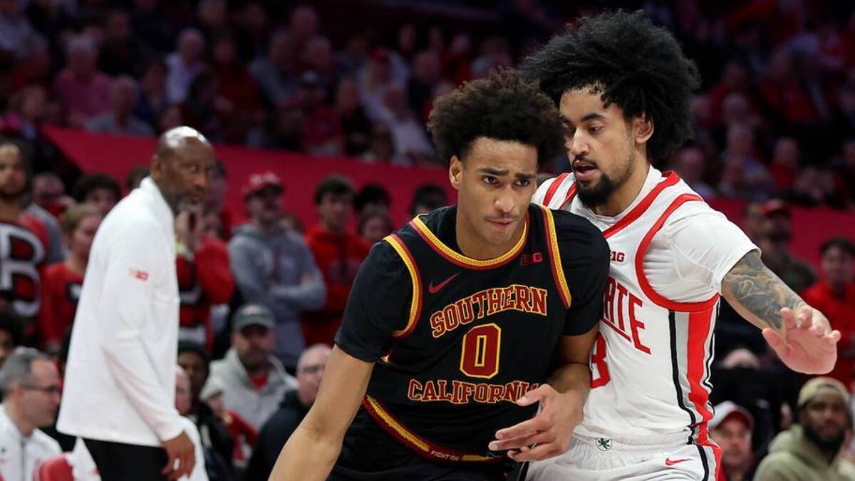  Feb 11, 2026; Columbus, Ohio, USA; USC Trojans guard Alijah Arenas (0) dribbles the ball as Ohio State Buckeyes guard Taison Chatman (3) defends during the first half at Value City Arena. Mandatory Credit: Joseph Maiorana-Imagn Images | Joseph Maiorana-Imagn Images 