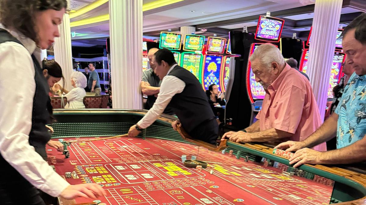  Passengers play slots and table games in Celebrity Cruises' Blue Chip casino 