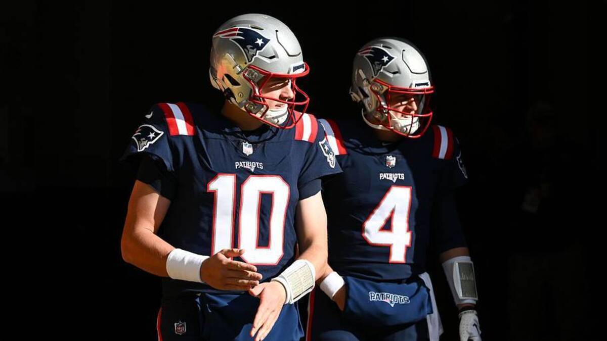  Nov 20, 2022; Foxborough, Massachusetts, USA; New England Patriots quarterback Mac Jones (10) and quarterback Bailey Zappe (4) walk onto the field before a game against the New York Jets at Gillette Stadium. Mandatory Credit: Brian Fluharty-USA TODAY Sports | USA TODAY Sports 