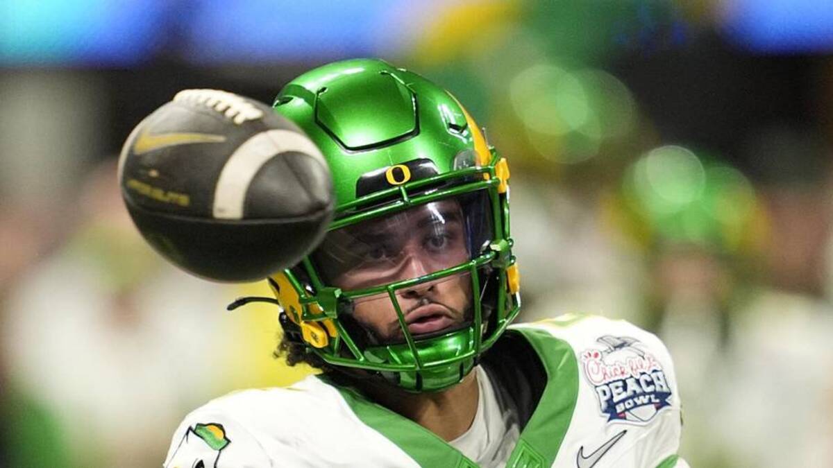  Jan 9, 2026; Atlanta, GA, USA; Oregon Ducks quarterback Dante Moore (5) throws a pass during the fourth quarter the 2025 Peach Bowl and semifinal game of the College Football Playoff at Mercedes-Benz Stadium. Mandatory Credit: Dale Zanine-Imagn Images | Dale Zanine-Imagn Images 