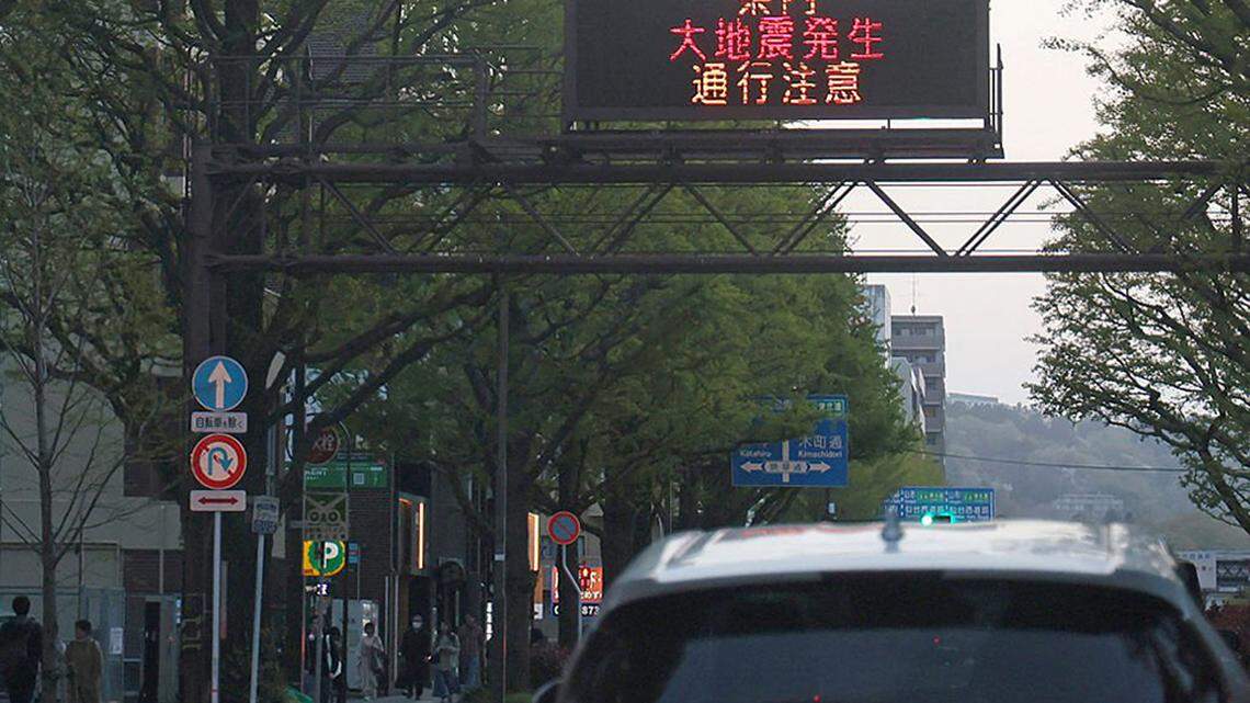 An electronic bulletin board warning about the earthquake after hitting northern Japan, in Sendai city, Miyagi Prefecture, on Monday. A 7.7-magnitude earthquake struck northern Japan, Japan's Meteorological Agency said, issuing tsunami warnings along the coastline that were later downgraded. A handful of injuries were reported, along with minor damage to buildings.