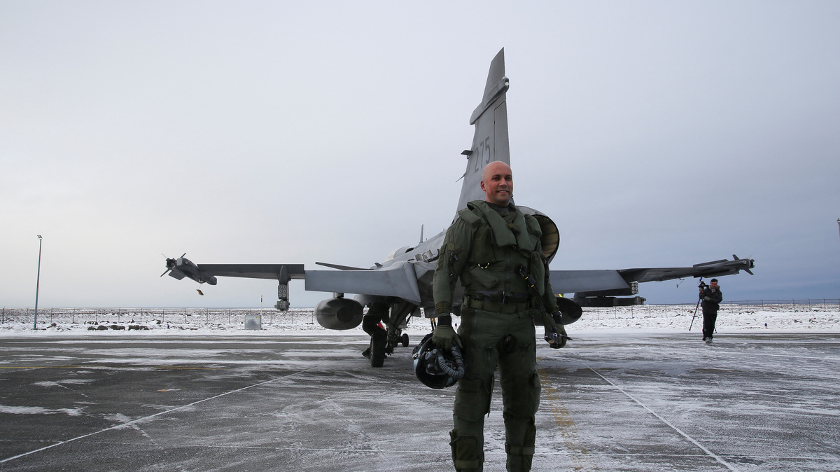 Squadron commander and pilot in the Swedish Air Force, Lieutenant Colonel Robin Arvidsson, stands for a photograph in front of a JAS 39 Gripen, in Keflavik, Iceland, March 3, 2026. REUTERS/Tom Little