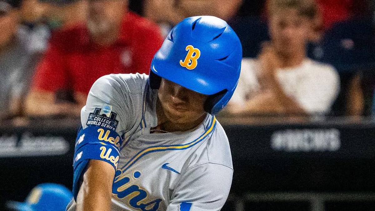  Jun 17, 2025; Omaha, Neb, USA; UCLA Bruins first baseman Mulivai Levu (39) hits a triple against the Arkansas Razorbacks during the ninth inning at Charles Schwab Field. Mandatory Credit: Dylan Widger-Imagn Images | Dylan Widger-Imagn Images 