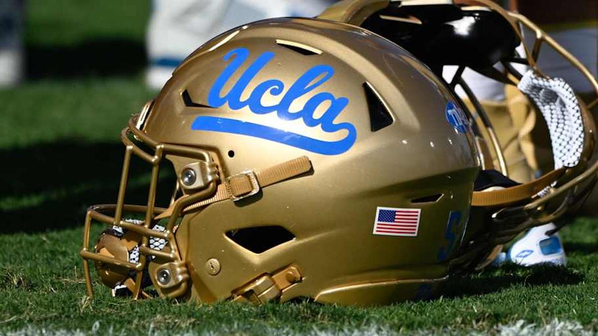  Nov 30, 2024; Pasadena, California, USA; UCLA Bruins helmets during pregame warmups before playing the Fresno State Bulldogs at Rose Bowl. Mandatory Credit: Robert Hanashiro-Imagn Images | Robert Hanashiro-Imagn Images 
