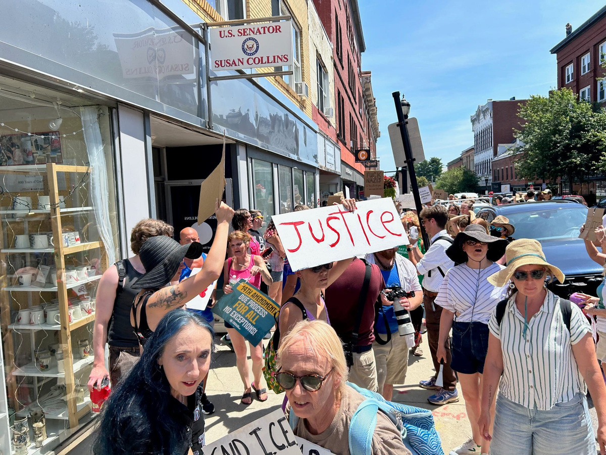 Protesters against Immigration and Customs Enforcement gather outside Republican Sen. Susan Collins' office in Biddeford, Maine, July 13, 2026, hours after a fatal shooting was reported.