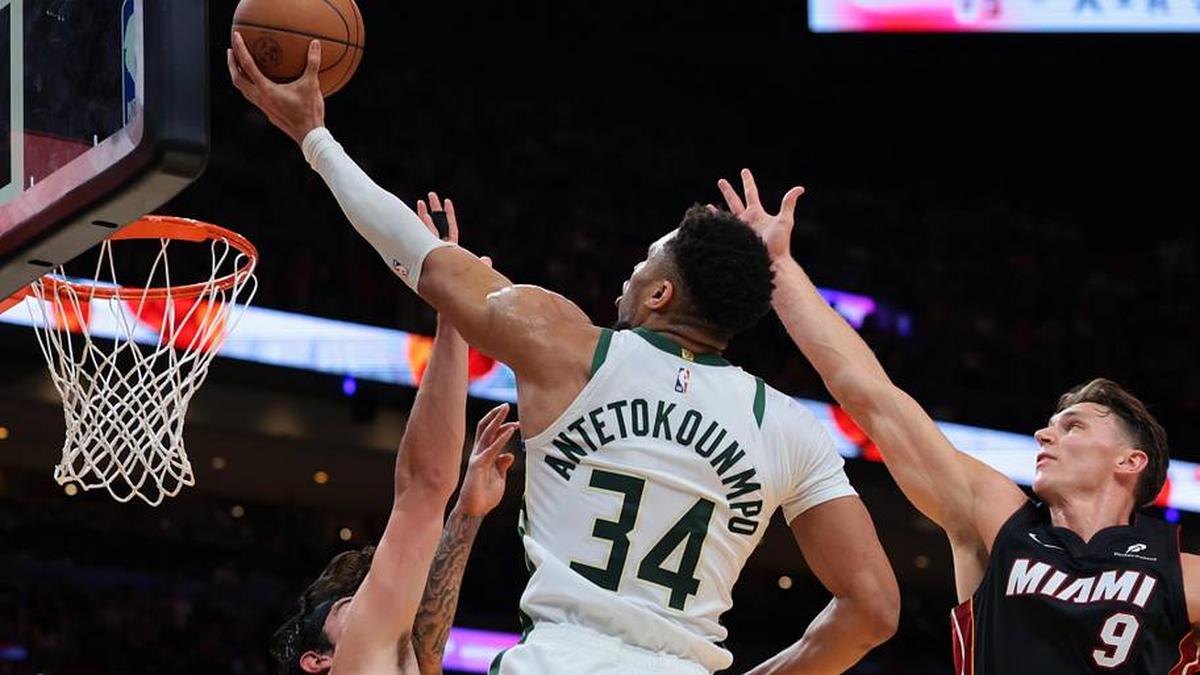  Mar 12, 2026; Miami, Florida, USA; Milwaukee Bucks forward Giannis Antetokounmpo (34) drives to the basket against Miami Heat guard Pelle Larsson (9) and forward Jaime Jaquez Jr. (11) during the second quarter at Kaseya Center. Mandatory Credit: Sam Navarro-Imagn Images | Sam Navarro-Imagn Images 