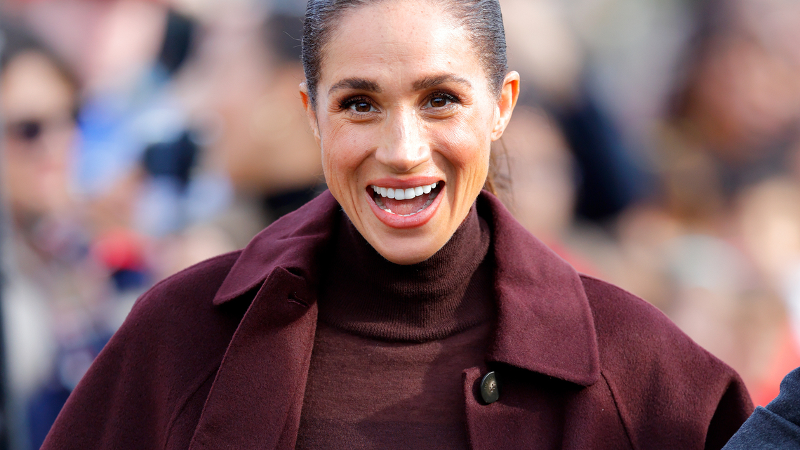 Meghan Markle Wore a Long, Drapey Coat in Fall's Most Elegant Color 