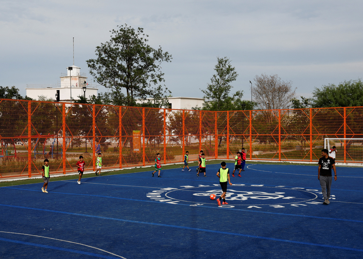 Children play soccer in Liberty Park, built on the former Topo Chico prison in Monterrey, where dozens died in a 2016 massacre, as residents celebrate renewed safety while pushing to preserve the transformed space, in Monterrey, Mexico, May 12, 2026. REUTERS/Daniel Becerril