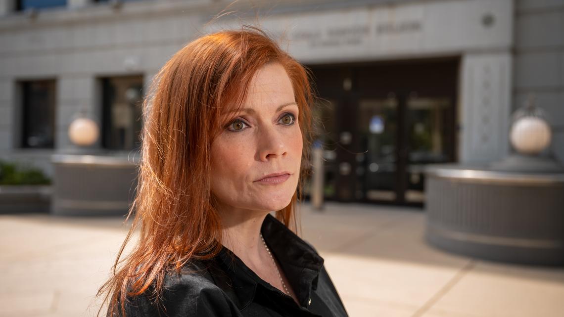 Heather Wilcox poses for a portrait in front of the Colorado Department of Human Services building in Denver on Thursday, April 17, 2026. Wilcox, a 20-year state employee, said she was administratively discharged from her communications job with Colorado's Division for the Deaf, Hard of Hearing and DeafBlind — part of the Department of Human Services — after she took an extended leave following her parents' deaths. (Hyoung Chang/The Denver Post/TNS)