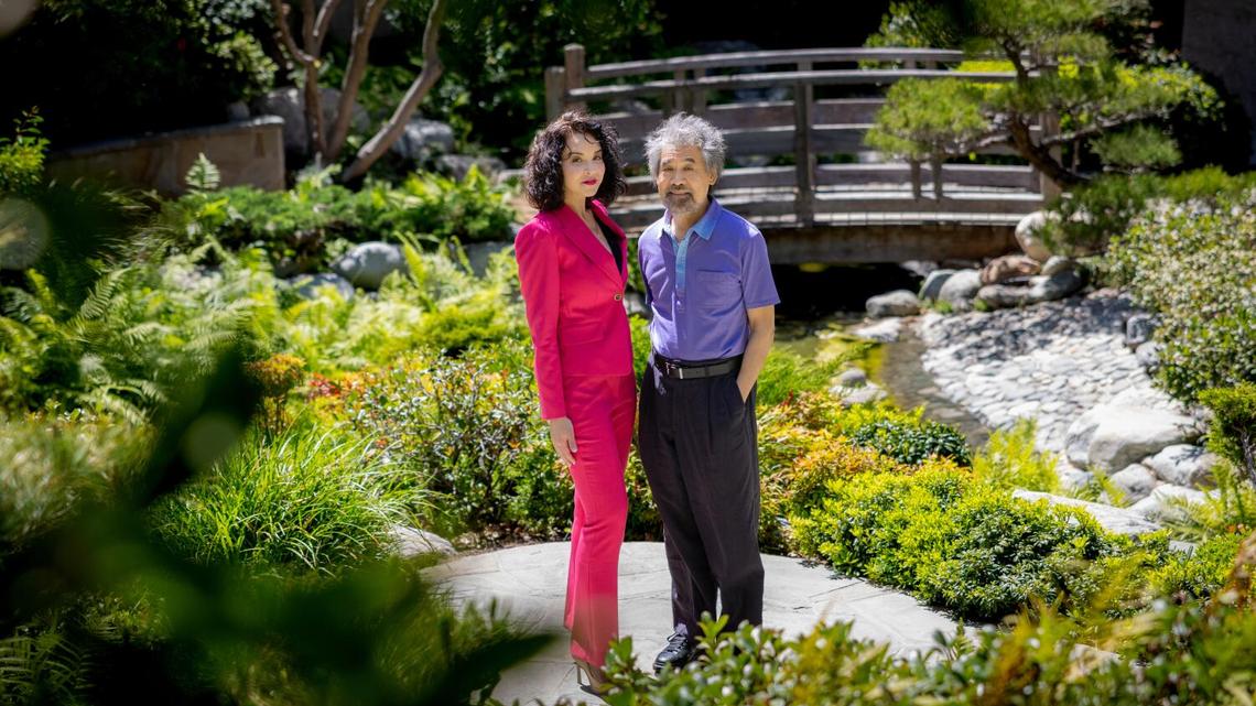 Los Angeles, CA - April 23, 2026  - Alexandra Silber (book adapter, Brigadoon) and David Henry Hwang (book adapter, Flower Drum Song) pose for a portrait at James Irvine Japanese Garden on Thursday, April 23, 2026 in Los Angeles, CA. (Jason Armond / Los Angeles Times)