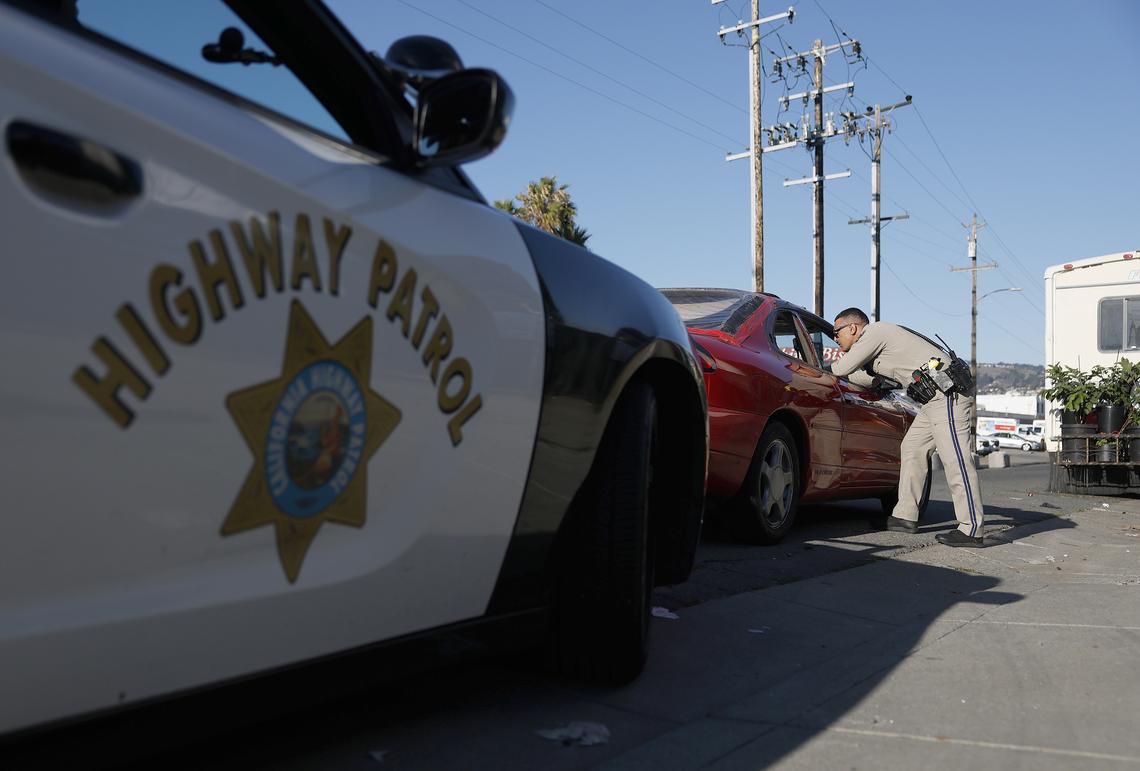 California Highway Patrol (CHP) officer Adib Zeid talks to a driver during a traffic stop.