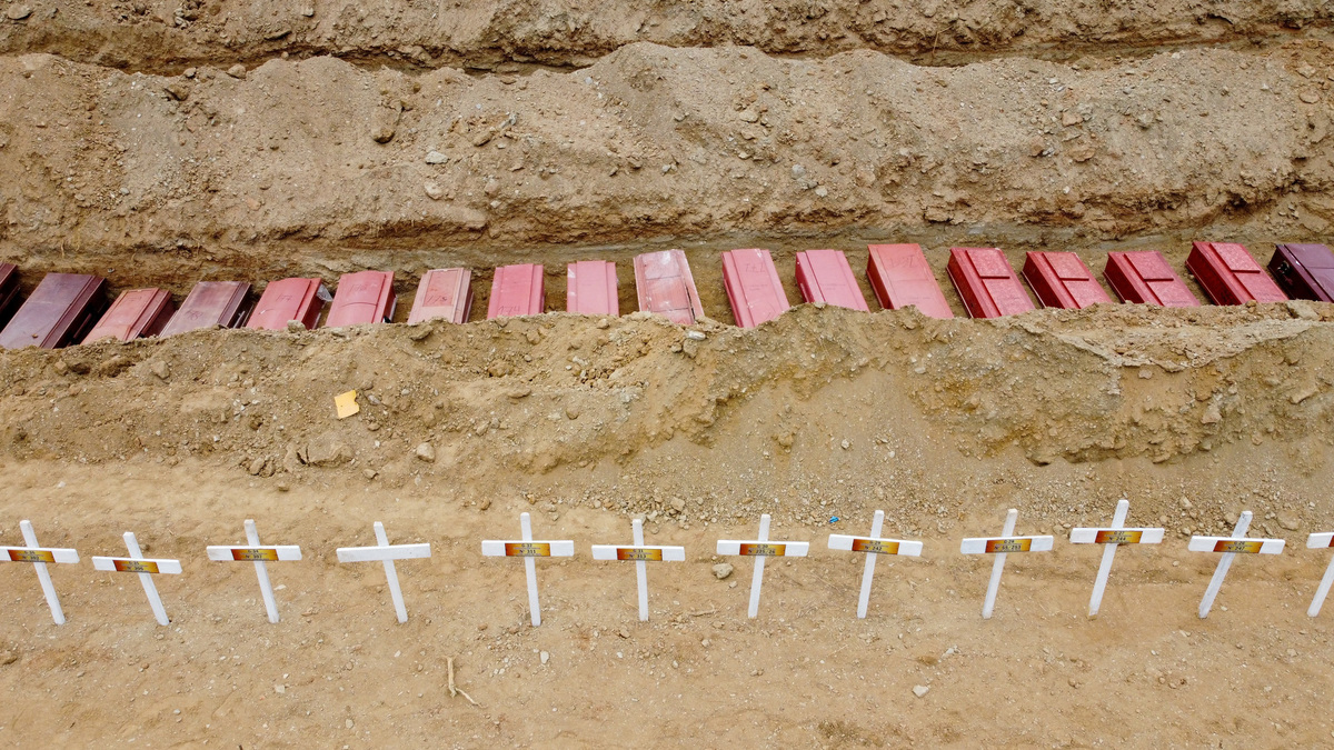 A drone view of coffins on the day of the burial of earthquake victims, in the aftermath of the June 24 earthquakes, at La Esperanza Cemetery, in La Guaira, Venezuela, July 6, 2026. REUTERS/Adriano Machado