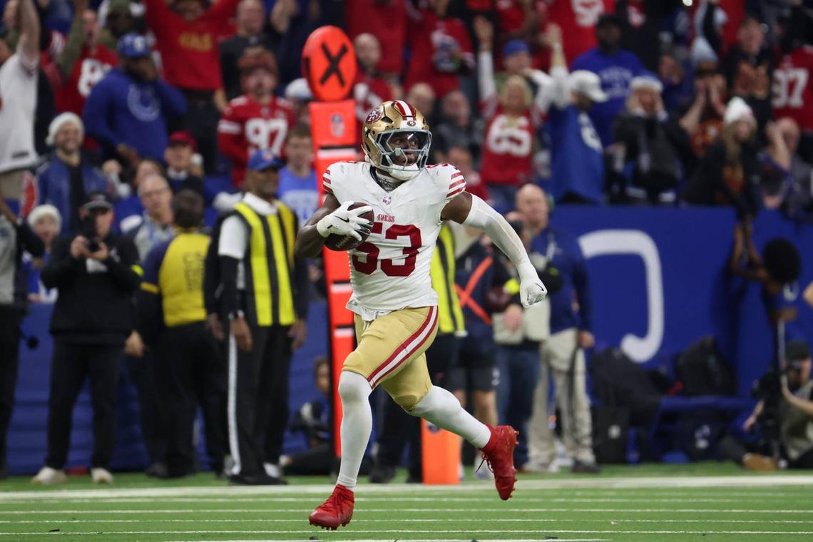  Dec 22, 2025; Indianapolis, Indiana, USA; San Francisco 49ers linebacker Dee Winters (53) carries the ball after an interception for a touchdown against the Indianapolis Colts in the fourth quarter of the game at Lucas Oil Stadium. Mandatory Credit: Trevor Ruszkowski-Imagn Images 