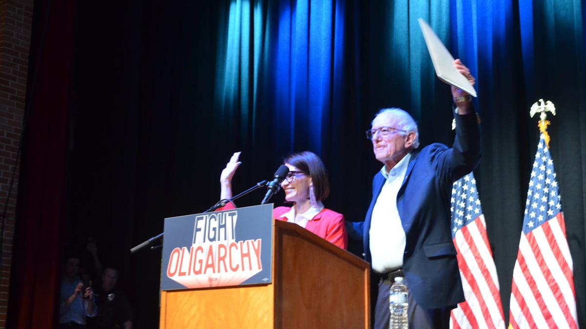 Minnesota Lt. Gov. Peggy Flanagan, left, and Vermont Sen. Bernie Sanders wave to a crowd of about 1,300 people inside John Marshall High School auditorium Saturday, May 2, 2026 in Rochester, Minn. (Trey Mewes/The Minnesota Star Tribune/TNS)