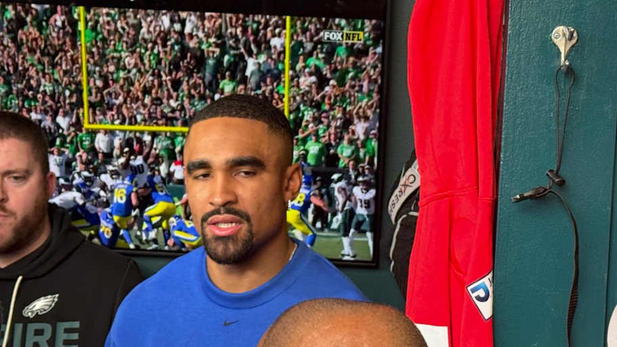  Jalen Hurts talks at his locker during the Eagles' final day together as they cleaned out their lockers a day after their season ended in the first round of the playoffs. | Ed Kracz/Eagles on SI 