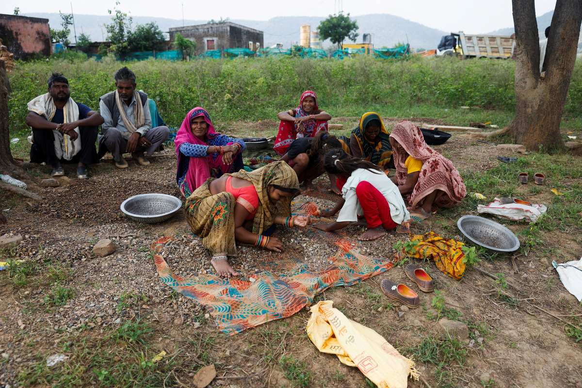 As rising waters flood homes and temples, villagers protest India's $87 ...