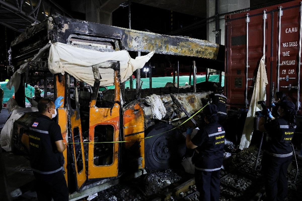 Emergency services work at a site where a train collided with a bus and several cars on Asok-Din Daeng Road, causing several casualties, in Bangkok, Thailand, May 16, 2026. REUTERS/Athit Perawongmetha