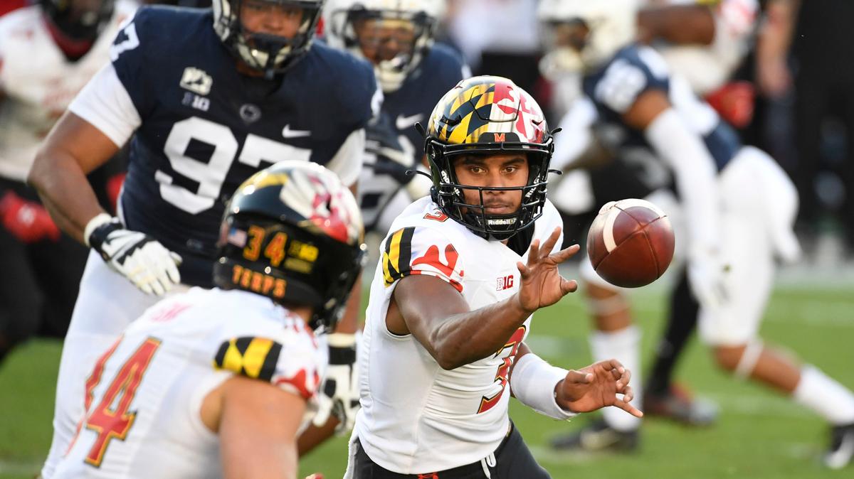Maryland quarterback Taulia Tagovailoa (3) pitches the ball to Maryland running back Jake Funk (34) against Penn State in the first quarter of an NCAA college football game in State College, Pa., Saturday, Nov. 7, 2020. (AP Photo/Barry Reeger)