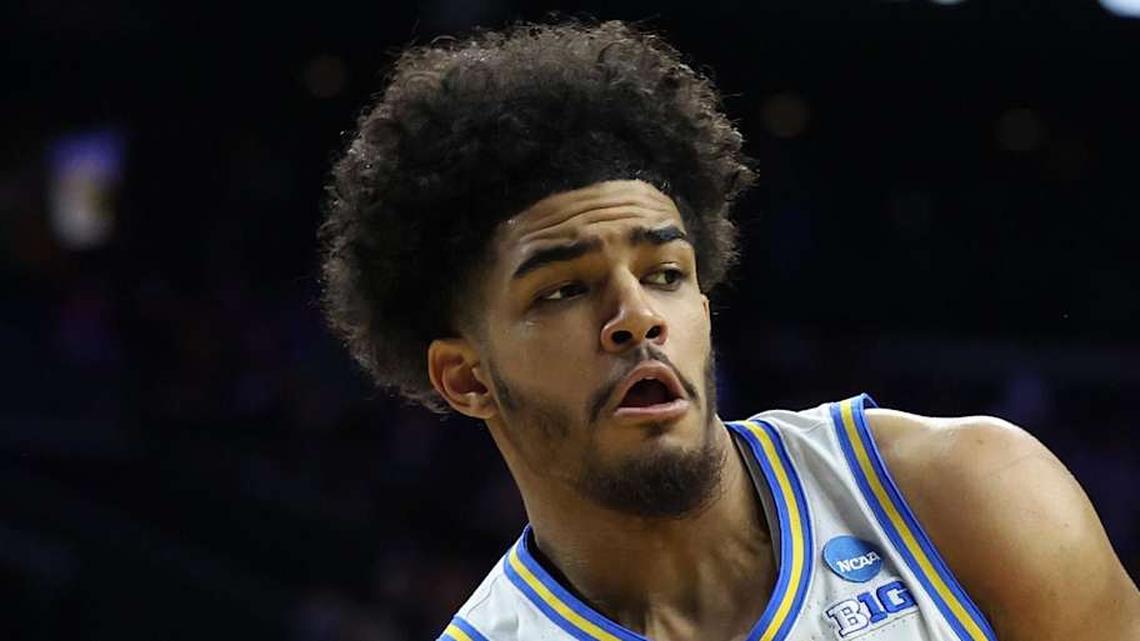  Mar 20, 2026; Philadelphia, PA, USA; UCLA Bruins guard Eric Freeny (8) makes a pass against UCF Knights center John Bol (7) in the second half during a first round game of the men's 2026 NCAA Tournament at Xfinity Mobile Arena. Mandatory Credit: Bill Streicher-Imagn Images | Bill Streicher-Imagn Images 