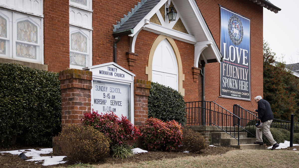 The Rev. John Jackman, who leads Trinity Moravian Church in Winston-Salem, North Carolina, says the church’s medical debt campaign has brought together people across the political spectrum. “This is the easiest money I’ve ever raised,” he says. (Allison Lee Isley for KFF Health News/TNS)  **KFF Health News provided photos must include credit/caption and can only be used with the original KFF Health News story**