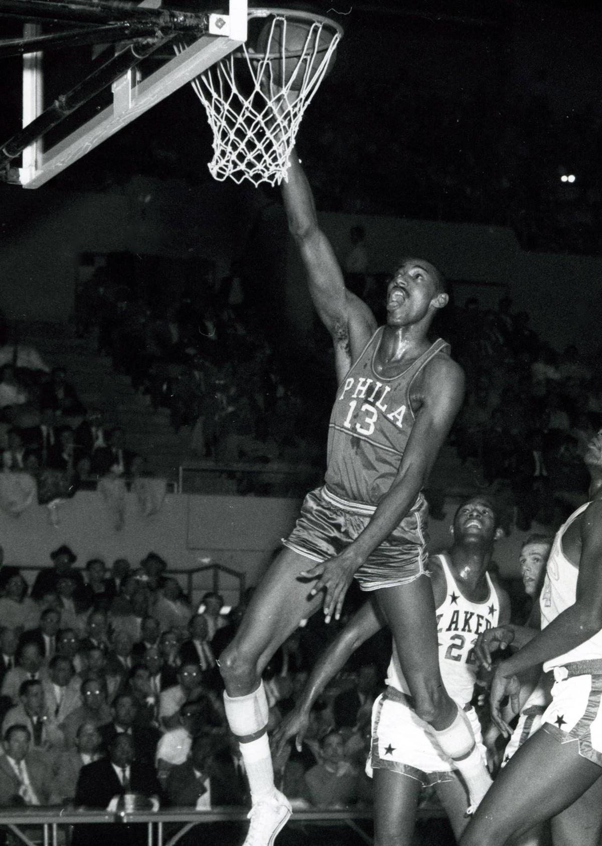  Wilt Chamberlain dunks against the Los Angeles Lakers. Darryl Norenberg-USA TODAY Sports
