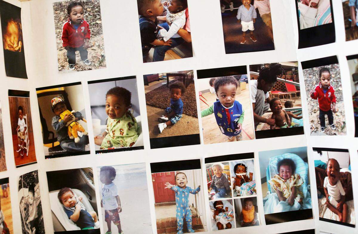 Photos of Jeremiah Moore, who died after a third cardiac surgery, are displayed at his family’s home in Raleigh, N.C., Oct. 5, 2018. Jeremiah’s parents considered taking him to Philadelphia for surgery, but said a doctor at UNC persuaded them to stay in Chapel Hill.