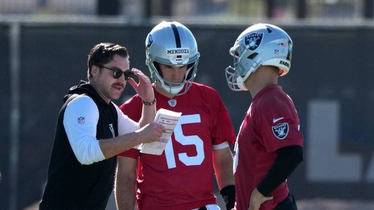  Jun 9, 2026; Henderson, NV, USA; Las Vegas Raiders offensive coordinator Andrew Janocko (left) talks with quarterbacks Fernando Mendoza (15) and Kirk Cousins (8) during minicamp at Intermountain Health Performance Center. Mandatory Credit: Kirby Lee-Imagn Images | Kirby Lee-Imagn Images 