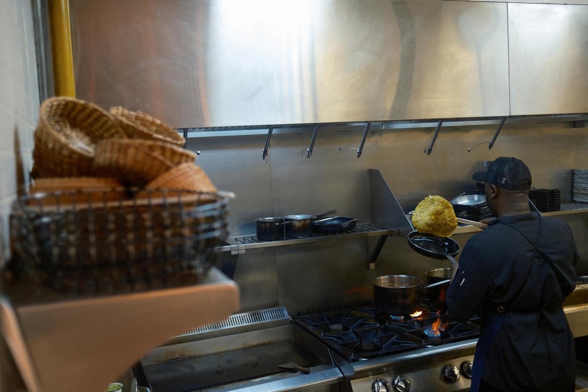 A chef prepares food at Lila Molino restaurant, in Dubai, United Arab Emirates, April 28, 2026. REUTERS
