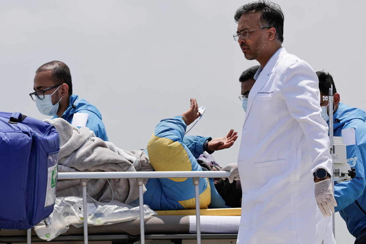 Paramedics transport Dawa Sherpa, who was missing for several days in the Everest region, from the helipad at HAMS Hospital in Kathmandu, Nepal, June 4, 2026. REUTERS/Navesh Chitrakar
