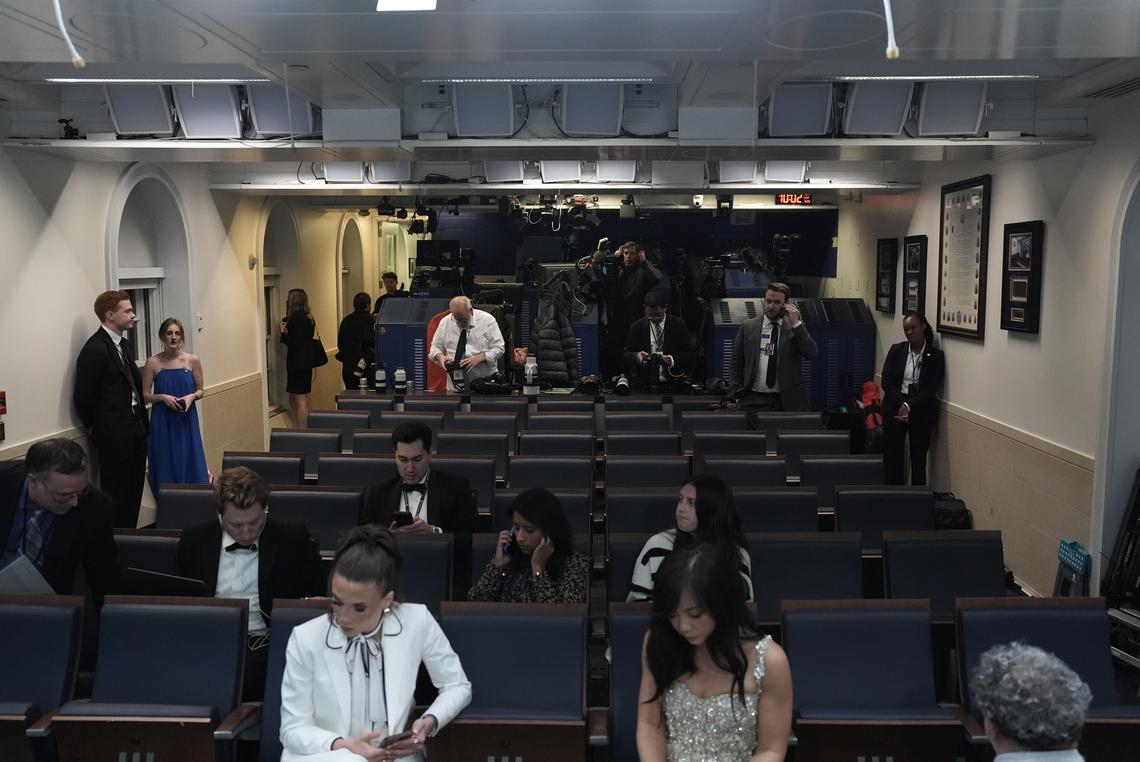 Reporters, many in formal wear, await the start of a briefing at the White House after shots were fired during the White House Correspondents' Association dinner in Washington on Saturday, April 25, 2026. President Donald Trump was rushed from the stage but appeared to be unharmed. (Salwan Georges/The New York Times)