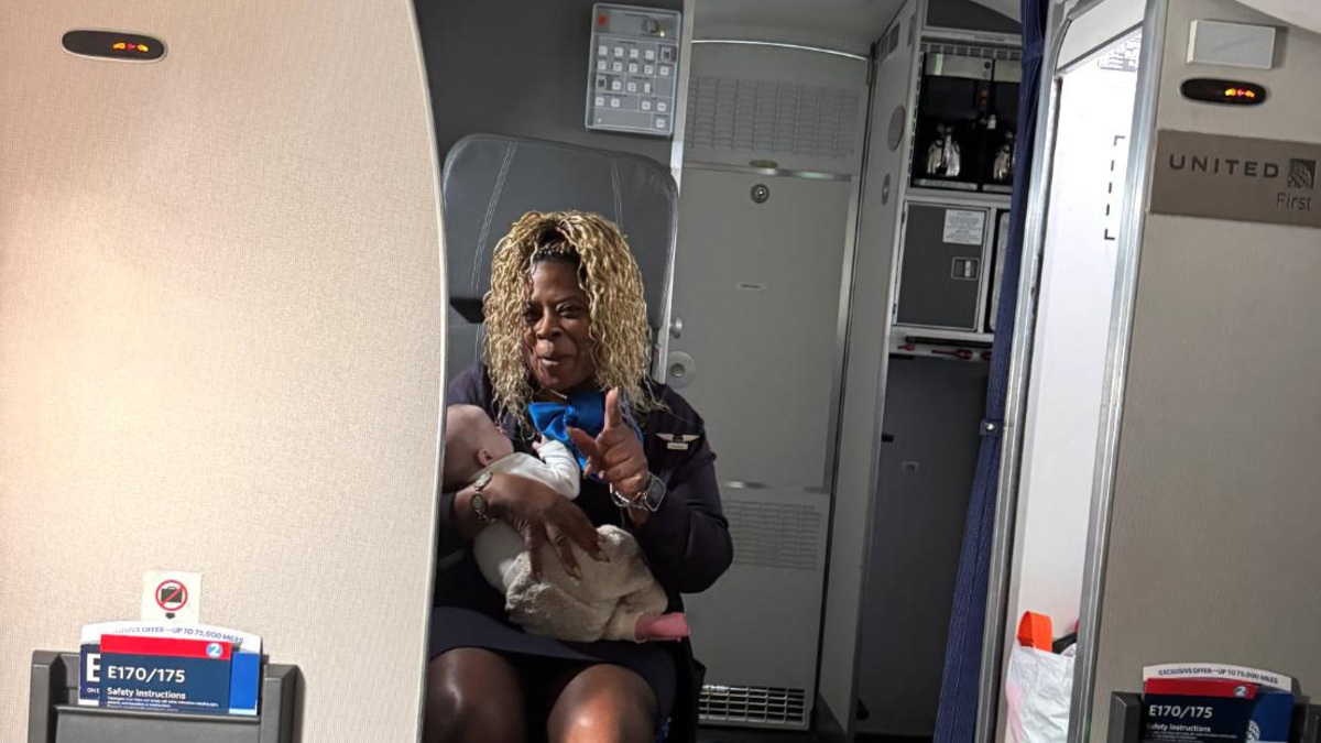 Flight attendant catches baby before it fell off tired mother's lap