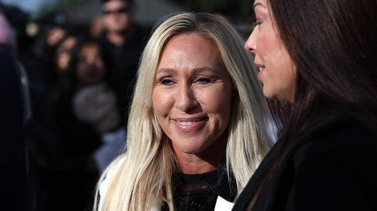 U.S. Rep. Marjorie Taylor Greene (R-Ga) stands with Epstein abuse survivor Haley Robson, right, during a news conference on the Epstein Files Transparency Act outside the U.S. Capitol in Washington on Nov. 18, 2025.