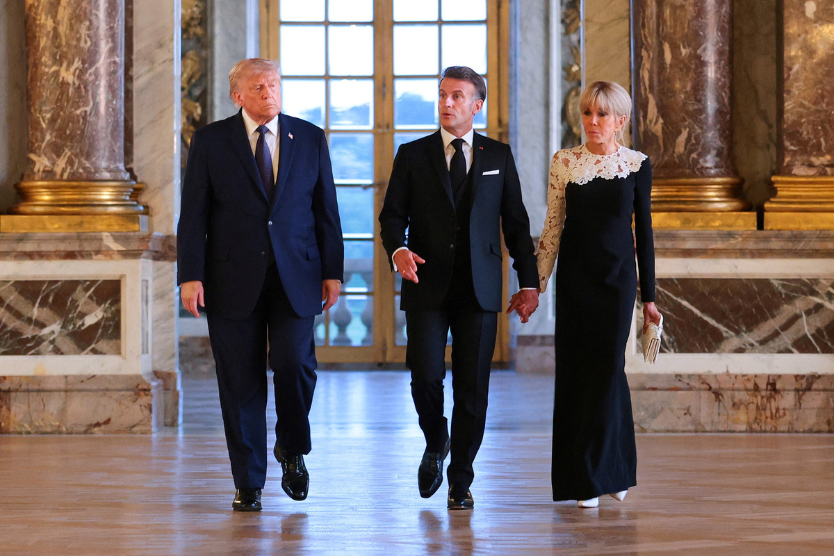 U.S. President Donald Trump receives a tour of Chateau de Versailles from President of France Emmanuel Macron and his wife Brigitte Macron ahead of a dinner, France, June 17, 2026. Anna Moneymaker/Pool via REUTERS