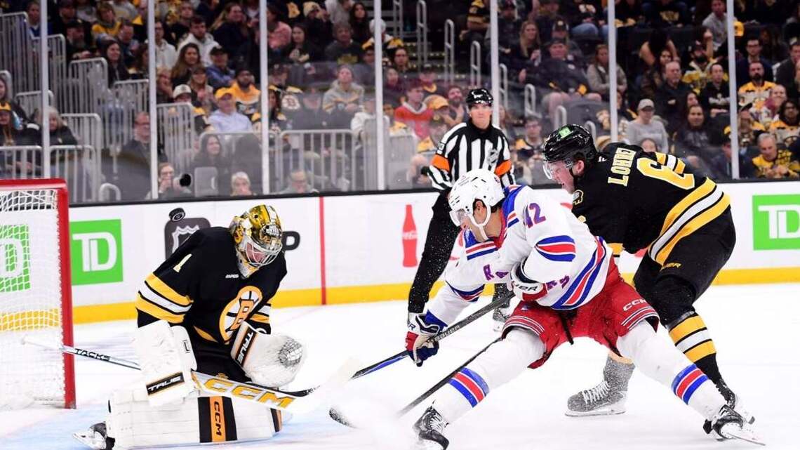 Bruins win 11th straight home opener with late surge past Rangers 