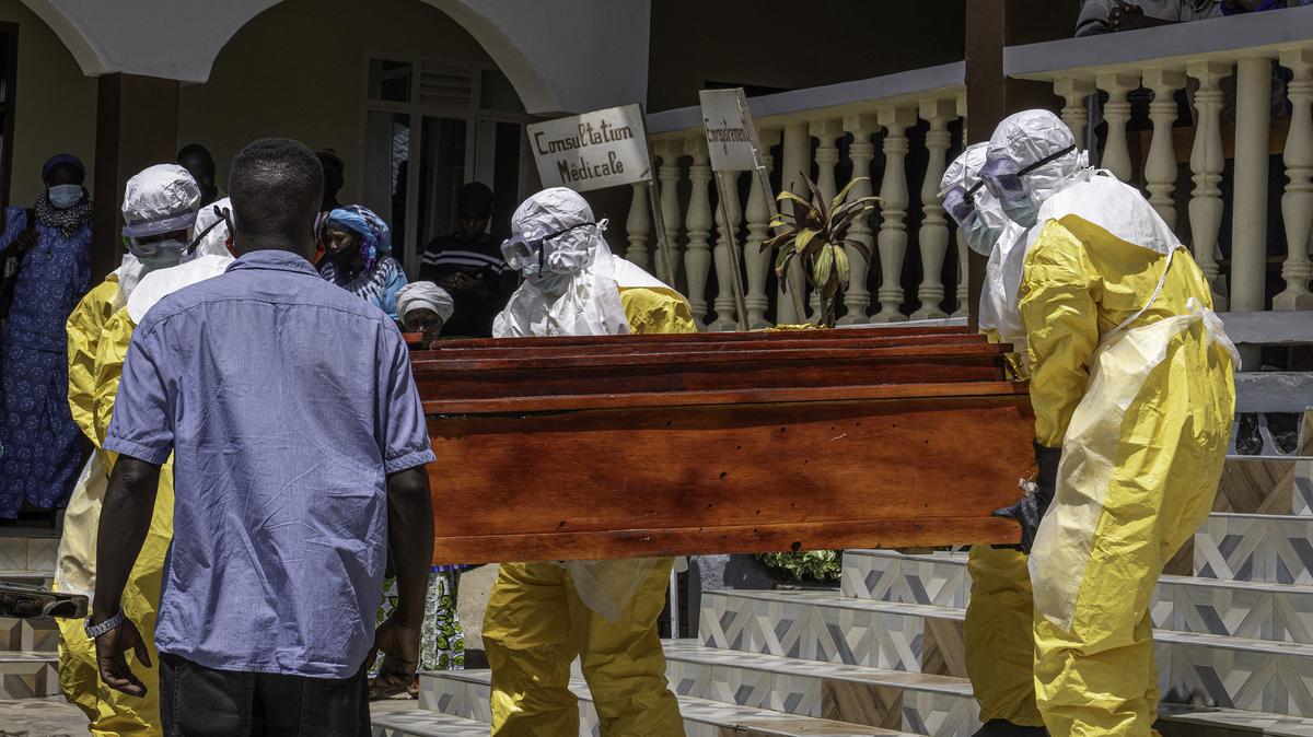 The coffin of a person suspected of having died from Ebola is carried onto a pick up truck by health worker at a hospital in Bunia, in the eastern Democratic Republic of the Congo, on Monday, May 25, 2026. (Glody Murhabazi/AFP/Getty Images/TNS)