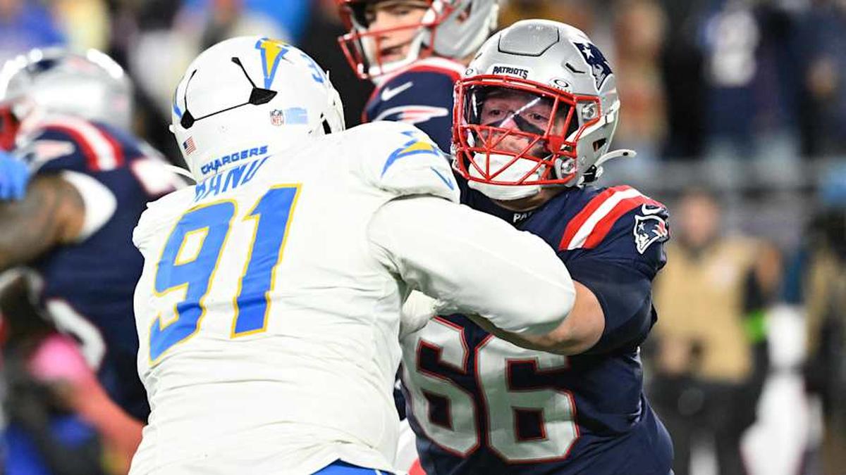  Jan 11, 2026; Foxborough, MA, USA; New England Patriots offensive tackle Will Campbell (66) blocks Los Angeles Chargers defensive tackle Da'shawn Hand (91) during the second half in an AFC Wild Card Round game at Gillette Stadium. Mandatory Credit: Eric Canha-Imagn Images | Eric Canha-Imagn Images 