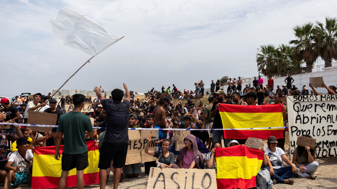 In Spain's Ceuta, hundreds of migrants stage protest and demand asylum