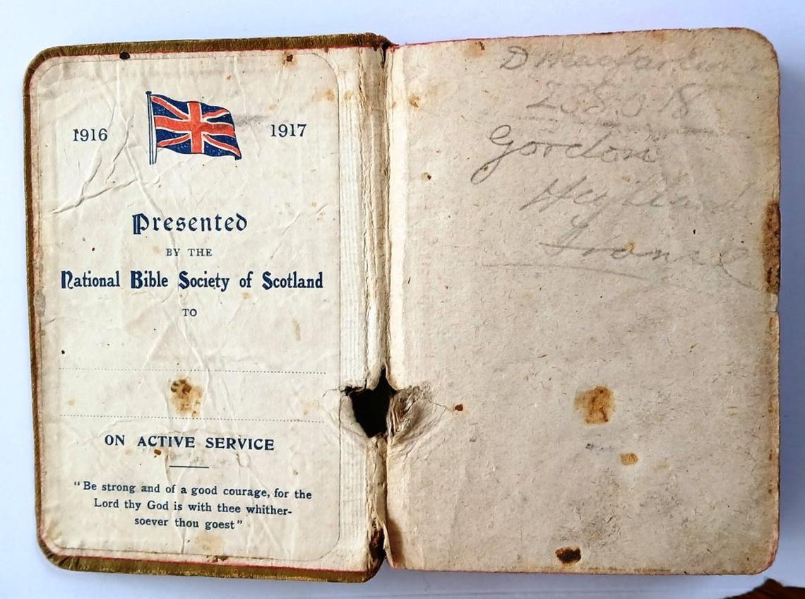  Private Duncan MacFarlane's Bible with the hole created by a bullet. (Dunscore Heritage Centre via SWNS) 