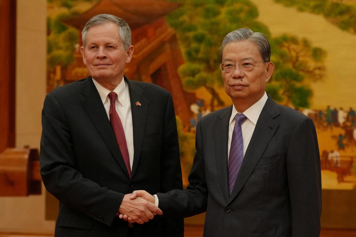 U.S. Senator Steve Daines and Zhao Leji, Chairman of the Standing Committee of the National People's Congress pose for a photograph prior to their bilateral meeting at the Great Hall of the People, in Beijing, China, May 7, 2026. Andy Wong/Pool via REUTERS