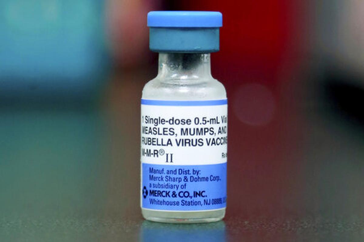 FILE - This Friday, May 17, 2019, file photo shows a vial of a measles, mumps and rubella vaccine in Mount Vernon, Ohio.