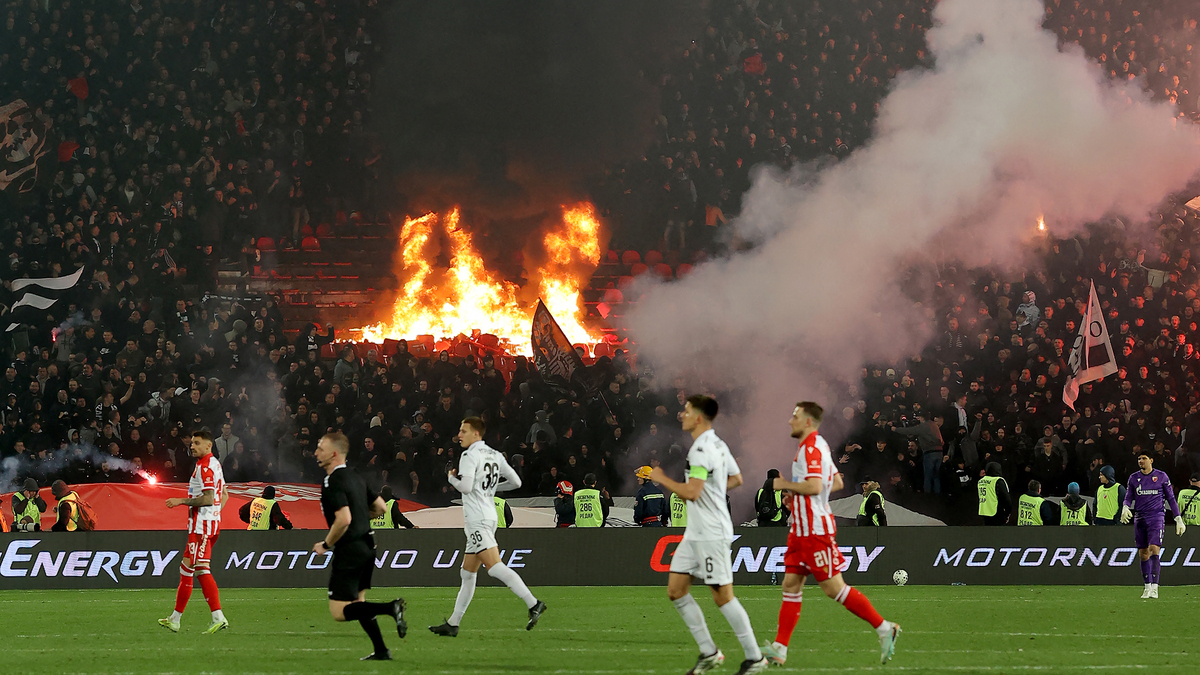 Partizan supporters set seats on fire during the Serbian SuperLiga football match between Crvena Zvezda (Red Star) and Partizan Belgrade at the Rajko Mitic Stadium in Belgrade on Feb. 22, 2026. Known as the "Eternal Derby," the rivalry between the capital's two biggest clubs dates back to 1947 and is widely considered one of the most intense football rivalries in Europe. (Pedja Milosavljevic/AFP via Getty Images/TNS)