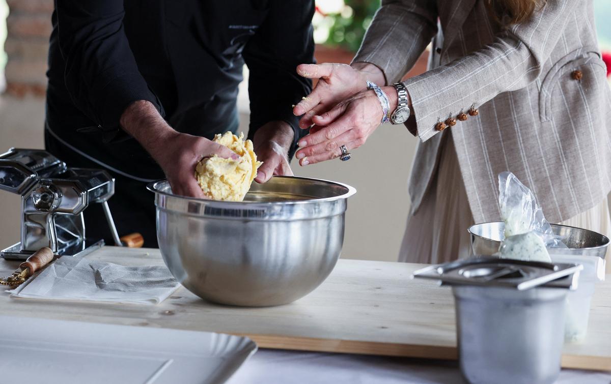 Britain's Kate, Princess of Wales, helps prepare lunch at rural Agriturismo 'Al Vigneto' as she concludes a two-day visit to the region, in Felino, in the province of Parma, Italy, May 14, 2026. REUTERS/Phil Noble/Pool