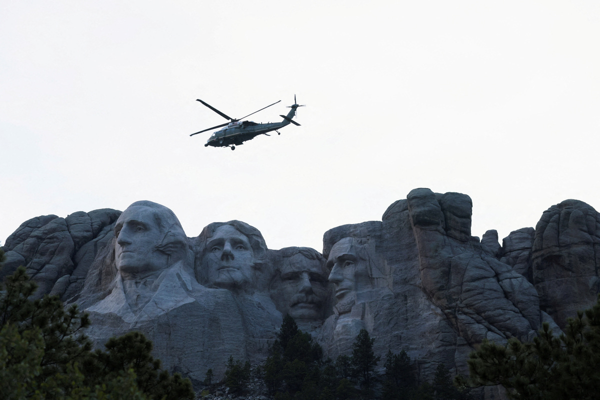 Marine One, carrying U.S. President Donald Trump, flies near Mount Rushmore in Keystone, South Dakota, U.S., July 3, 2026. REUTERS/Kylie Cooper