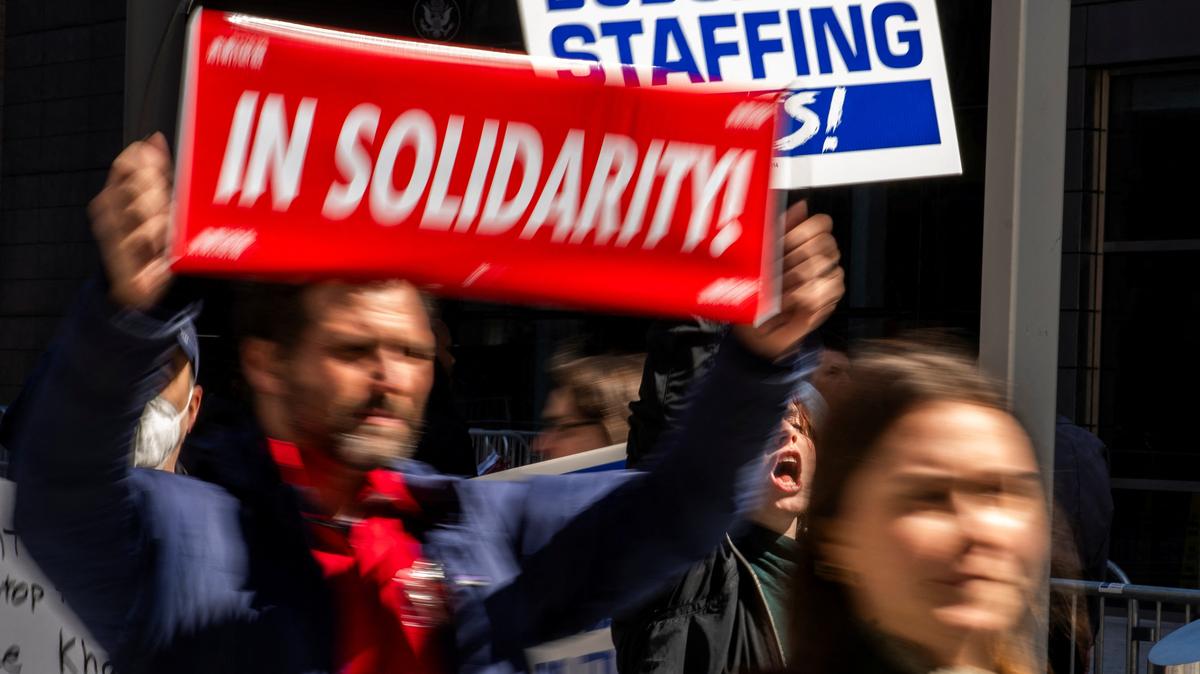 People attend a rally in support of federal workers outside the 26 Federal Plaza, a federal office building in New York City, on March 25, 2025. President Donald Trump signed an executive order on Wednesday making it easier to fire 8,000 of some of the best-paid government workers.