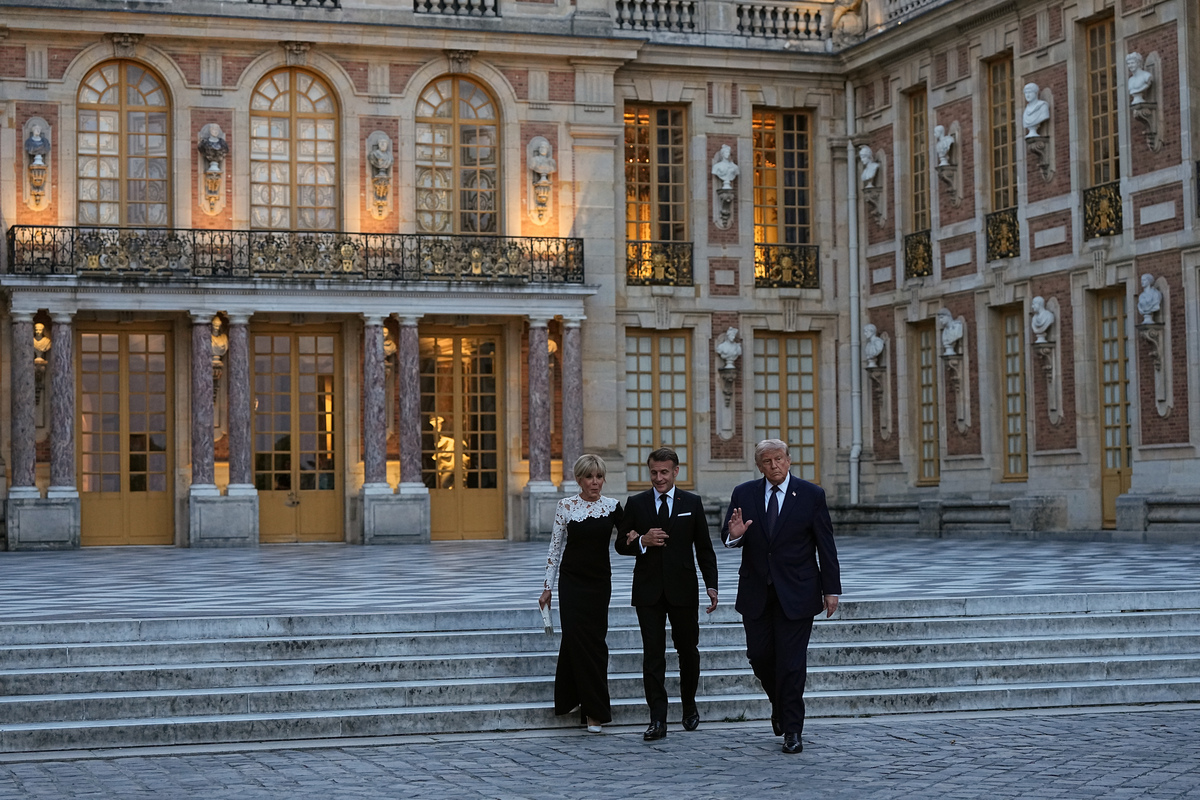 President Donald Trump is welcomed to the Palace of Versailles by President Emmanuel Macon of France and first lady Brigitte Macron in Versailles, France, on Wednesday evening, June 17, 2026. (Haiyun Jiang/The New York Times)