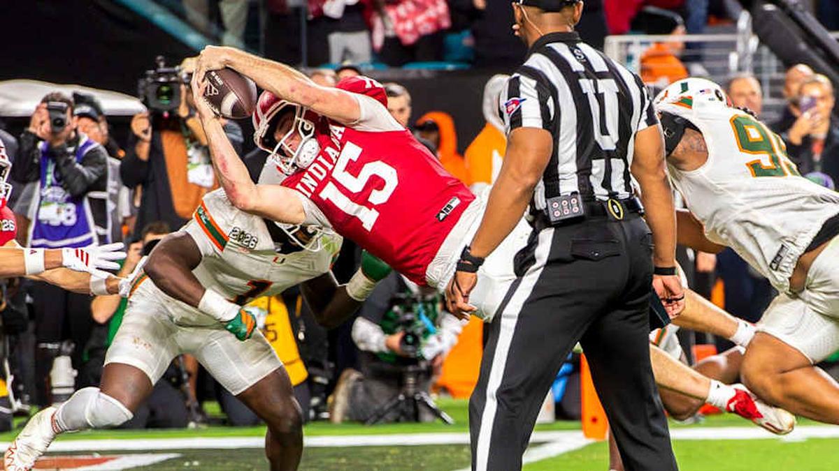  Mendoza's diving touchdown in the fourth quarter clinched the national championship for the Hoosiers. | Rich Janzaruk/Herald-Times / USA TODAY NETWORK via Imagn Images 