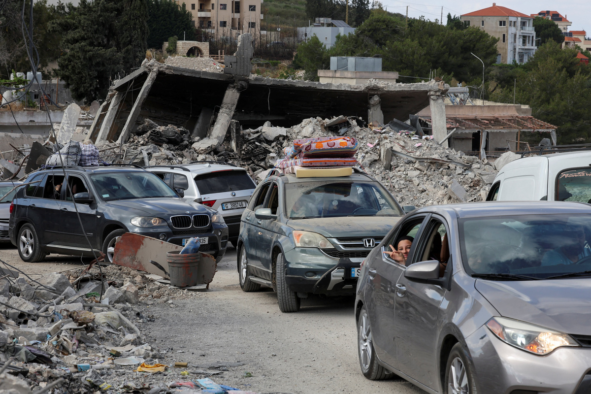 Displaced people transport their belongings in cars, as they make their way back to their homes, following a peace deal between the United States and Iran, in Bir Al-Salasil, Tyre district, southern Lebanon, June 15, 2026. REUTERS/Aziz Taher